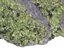 Peridot__green_crystals_in_basalt